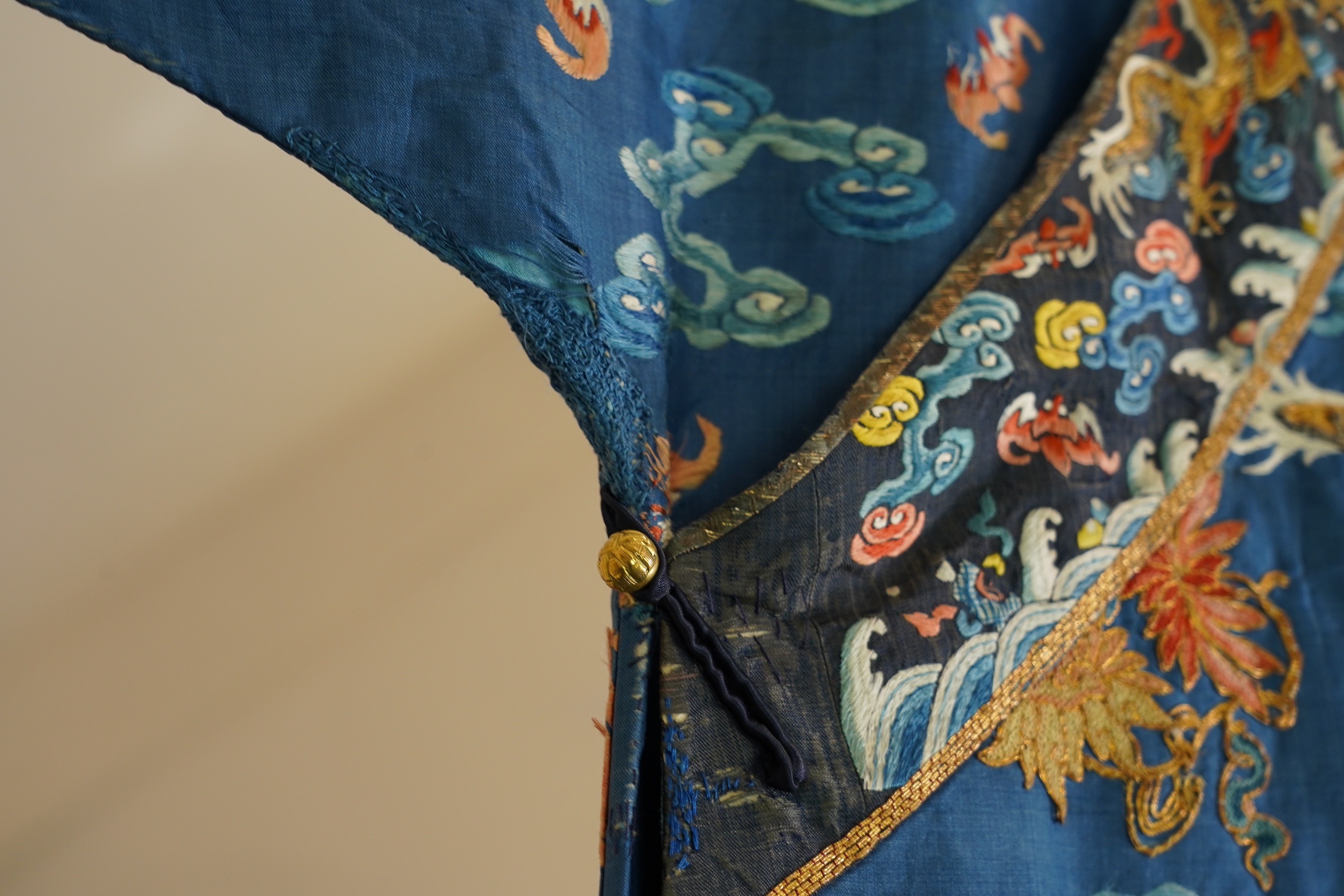 A Chinese blue silk man’s dragon robe, jifu, 19th century
